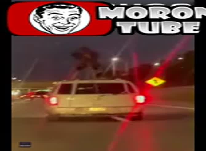 Video: WTF - In the middle of a Detroit expressway, standing on an SUV